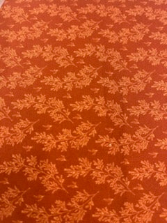 ENDOFBOLT111 Rust Orange background with Lighter Orange leaf accents basic 100% cotton quilting fabric